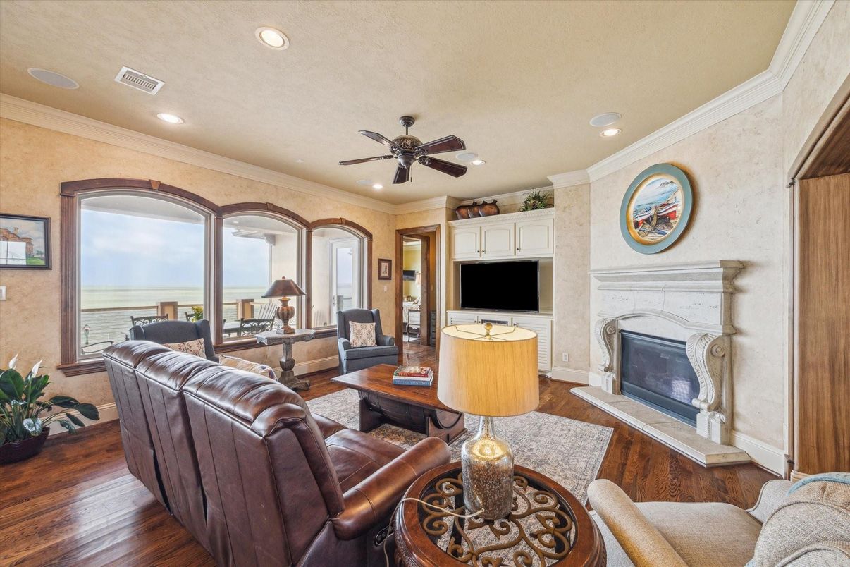 Fireplace, Interior, Living room, Recessed Lighting, Water, Wood Texture Flooring