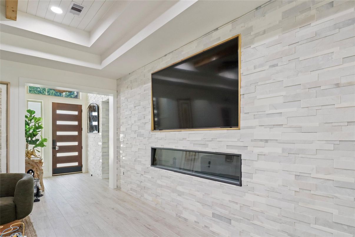 Fireplace, Interior, Recessed Lighting, Stone Walls, Wood Texture Flooring
