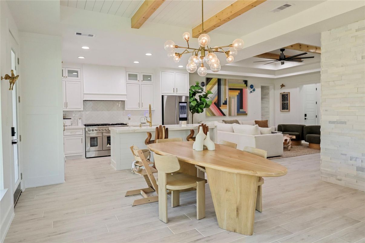 Dining room, Interior, Kitchen, Living room, Pendant Lights, Recessed Lighting, Stainless Steel Appliances, Stone Walls, Wooden Beams, Wood Texture Flooring