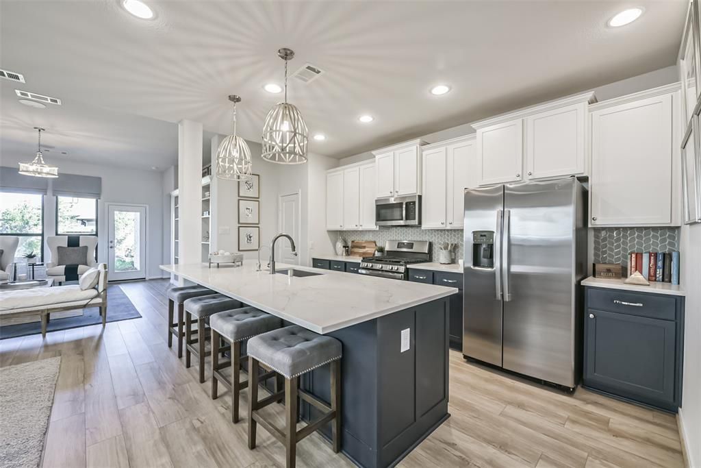 Chandelier, Interior, Kitchen, Living room, Pendant Lights, Recessed Lighting, Stainless Steel Appliances, Wood Texture Flooring