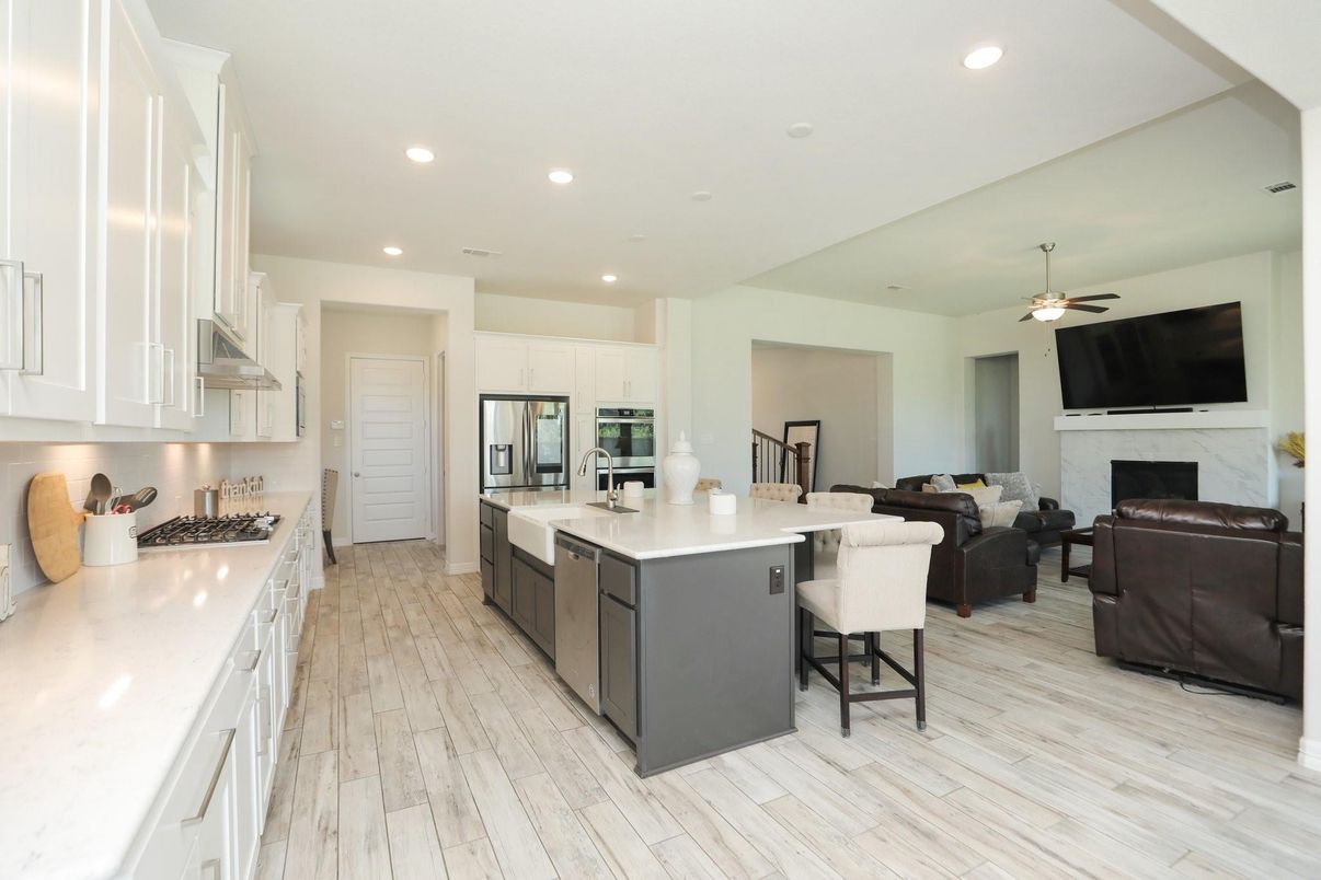 Fireplace, Interior, Kitchen, Living room, Recessed Lighting, Stainless Steel Appliances, Wood Texture Flooring