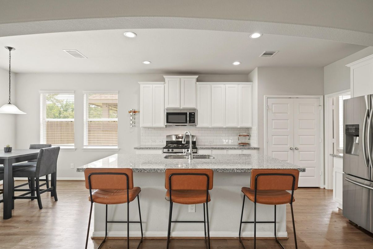 Dining room, Interior, Kitchen, Pendant Lights, Recessed Lighting, Stainless Steel Appliances, Wood Texture Flooring