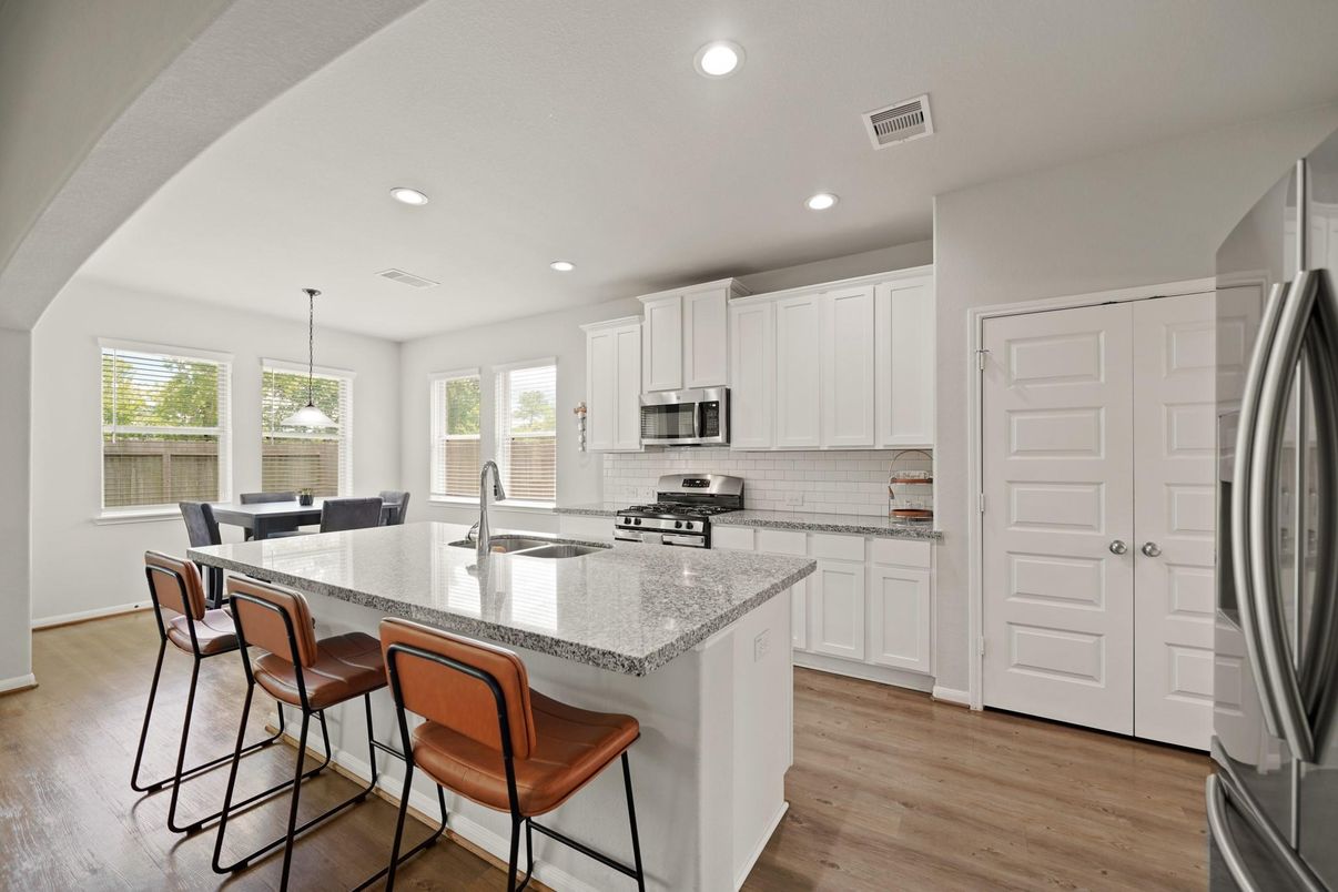 Dining room, Interior, Kitchen, Pendant Lights, Recessed Lighting, Stainless Steel Appliances, Wood Texture Flooring