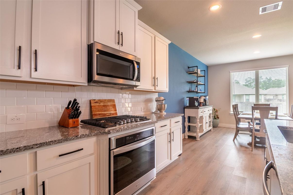 Dining room, Interior, Kitchen, Recessed Lighting, Stainless Steel Appliances, Wood Texture Flooring