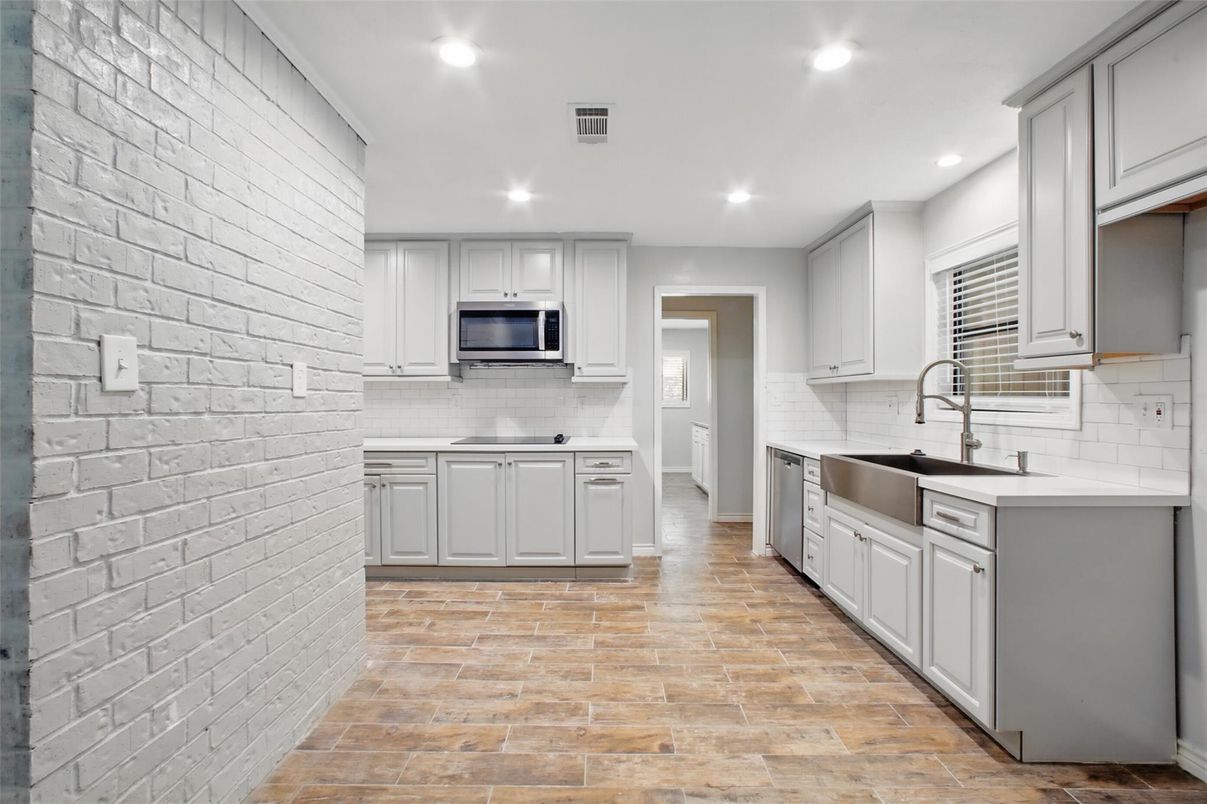 Interior, Kitchen, Recessed Lighting, Stainless Steel Appliances, Stone Walls, Wood Texture Flooring