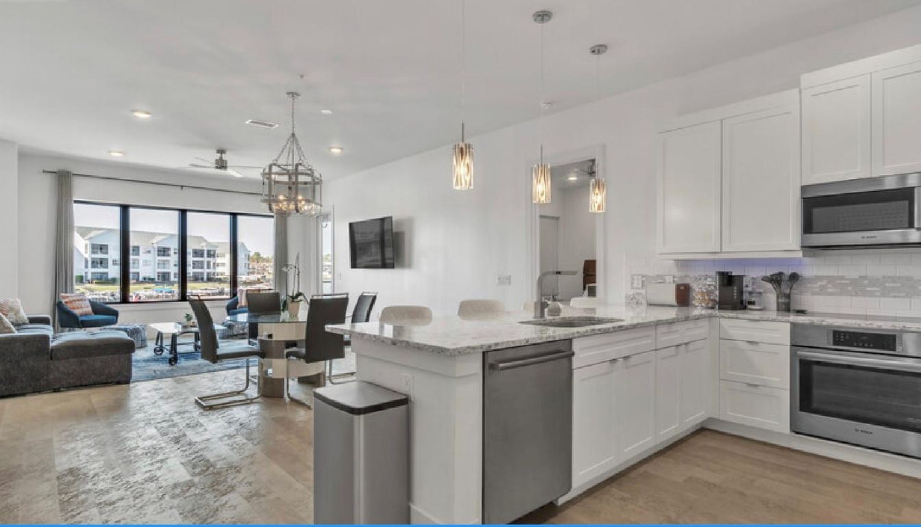 Chandelier, Dining room, Interior, Kitchen, Living room, Pendant Lights, Recessed Lighting, Stainless Steel Appliances, Wood Texture Flooring