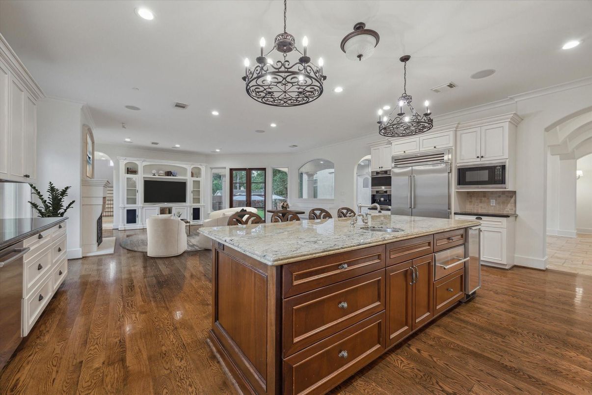 Chandelier, Interior, Kitchen, Living room, Recessed Lighting, Stainless Steel Appliances, Wood Texture Flooring