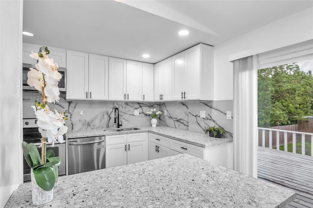 Interior, Kitchen, Marble Walls, Recessed Lighting, Stainless Steel Appliances