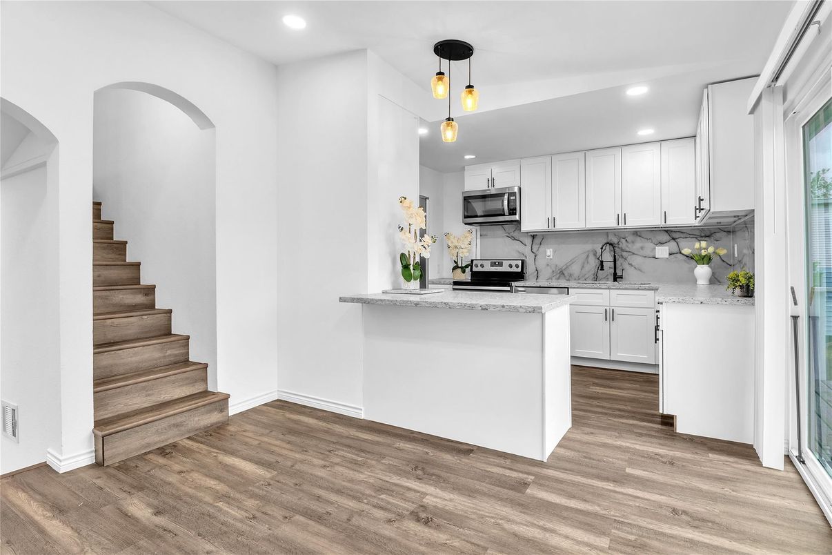 Interior, Kitchen, Marble Walls, Pendant Lights, Recessed Lighting, Stainless Steel Appliances, Wood Texture Flooring