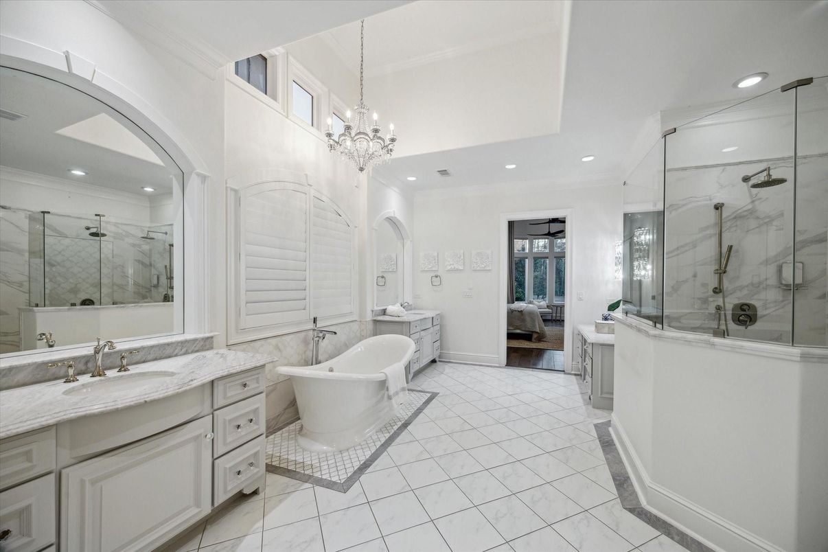 Bathroom, Chandelier, Dual Sink Vanities, Free Standing Baths, Glass Shower, Interior, Marble, Marble Walls, Recessed Lighting
