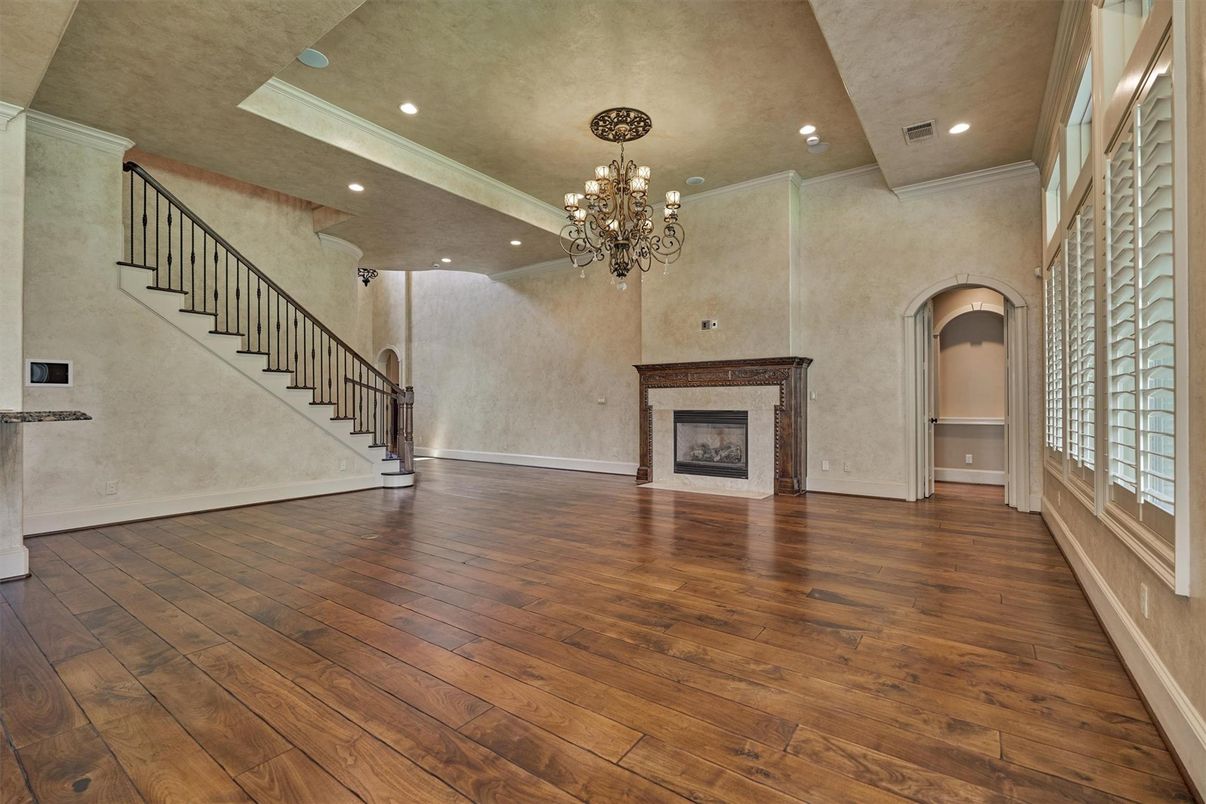 Chandelier, Empty room, Fireplace, Interior, Recessed Lighting, Wood Texture Flooring