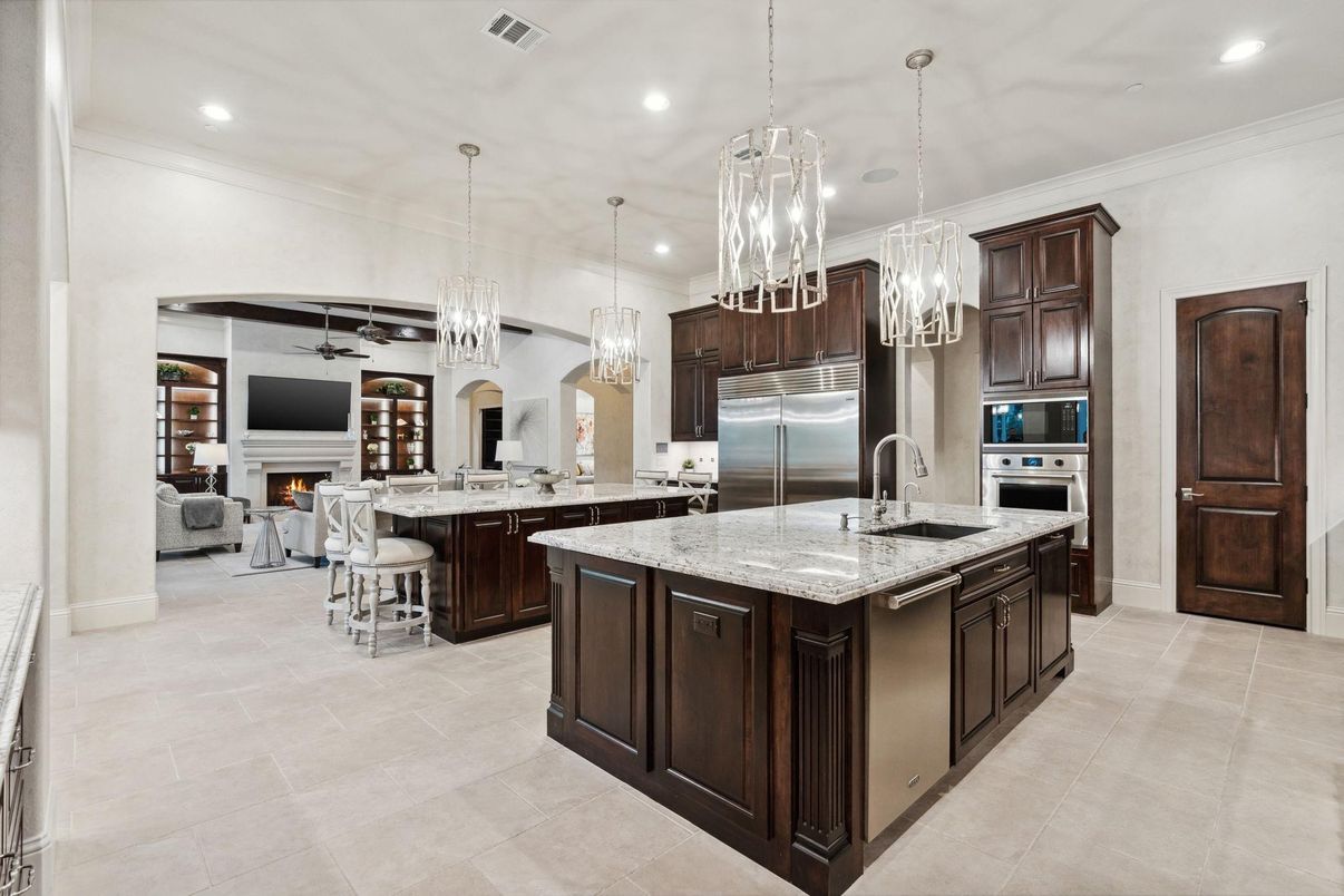 Chandelier, Fireplace, Interior, Kitchen, Living room, Pendant Lights, Recessed Lighting, Stainless Steel Appliances