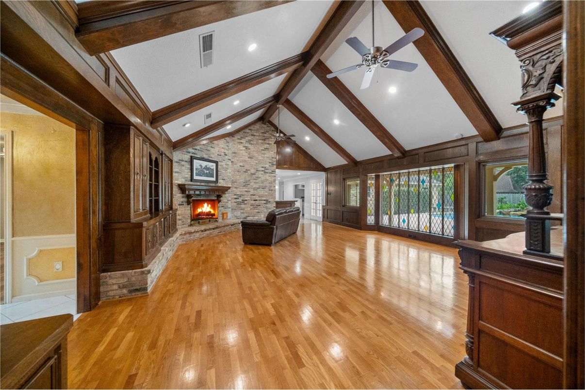 Empty room, Fireplace, Interior, Recessed Lighting, Stone Walls, Wooden Beams, Wood Texture Flooring