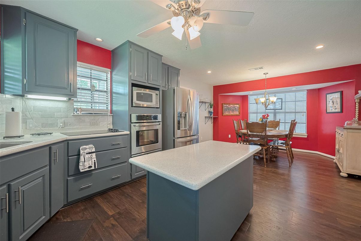 Chandelier, Dining room, Interior, Kitchen, Pendant Lights, Recessed Lighting, Stainless Steel Appliances, Wood Texture Flooring