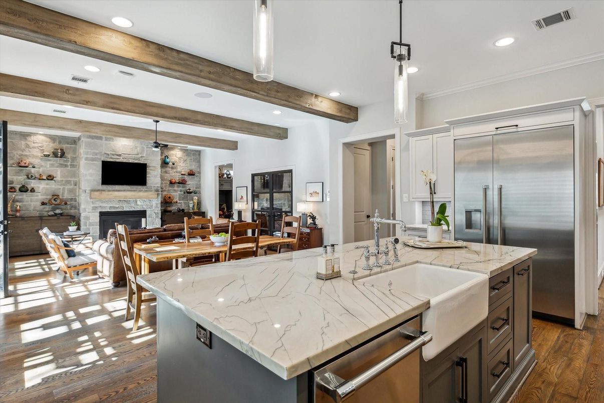 Dining room, Fireplace, Interior, Kitchen, Pendant Lights, Recessed Lighting, Stainless Steel Appliances, Stone Walls, Wooden Beams, Wood Texture Flooring