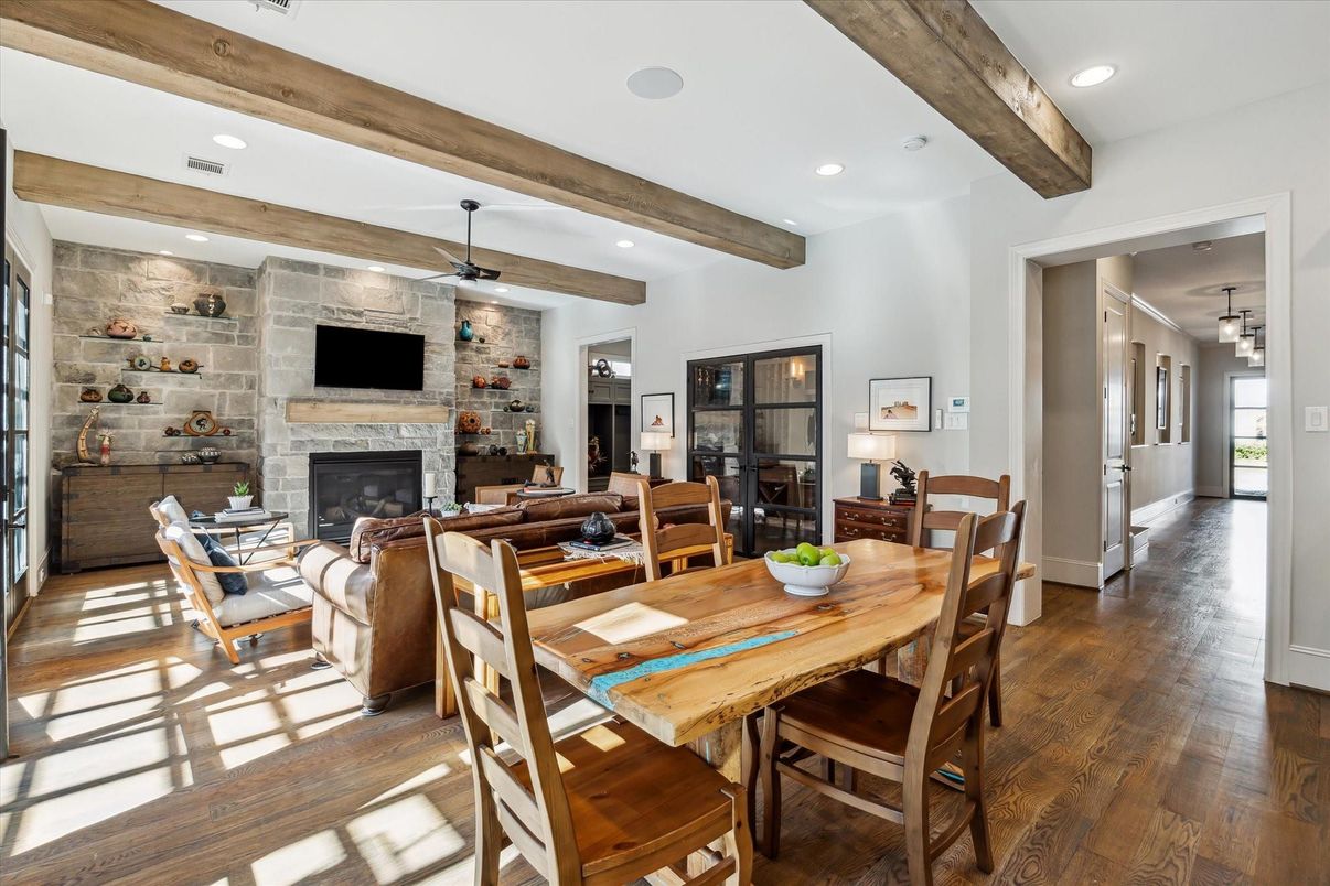 Dining room, Fireplace, Interior, Living room, Pendant Lights, Recessed Lighting, Stone Walls, Wooden Beams, Wood Texture Flooring