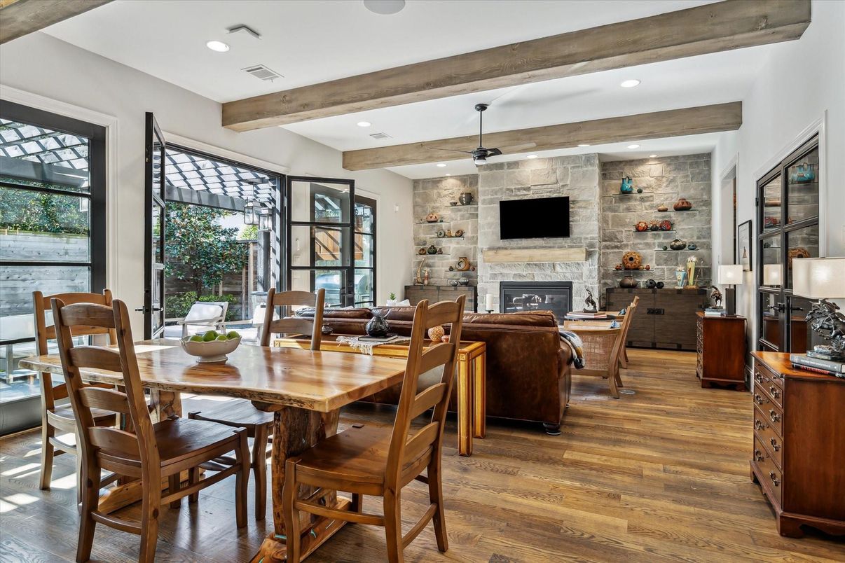Dining room, Fireplace, Interior, Living room, Recessed Lighting, Stone Walls, Wooden Beams, Wood Texture Flooring