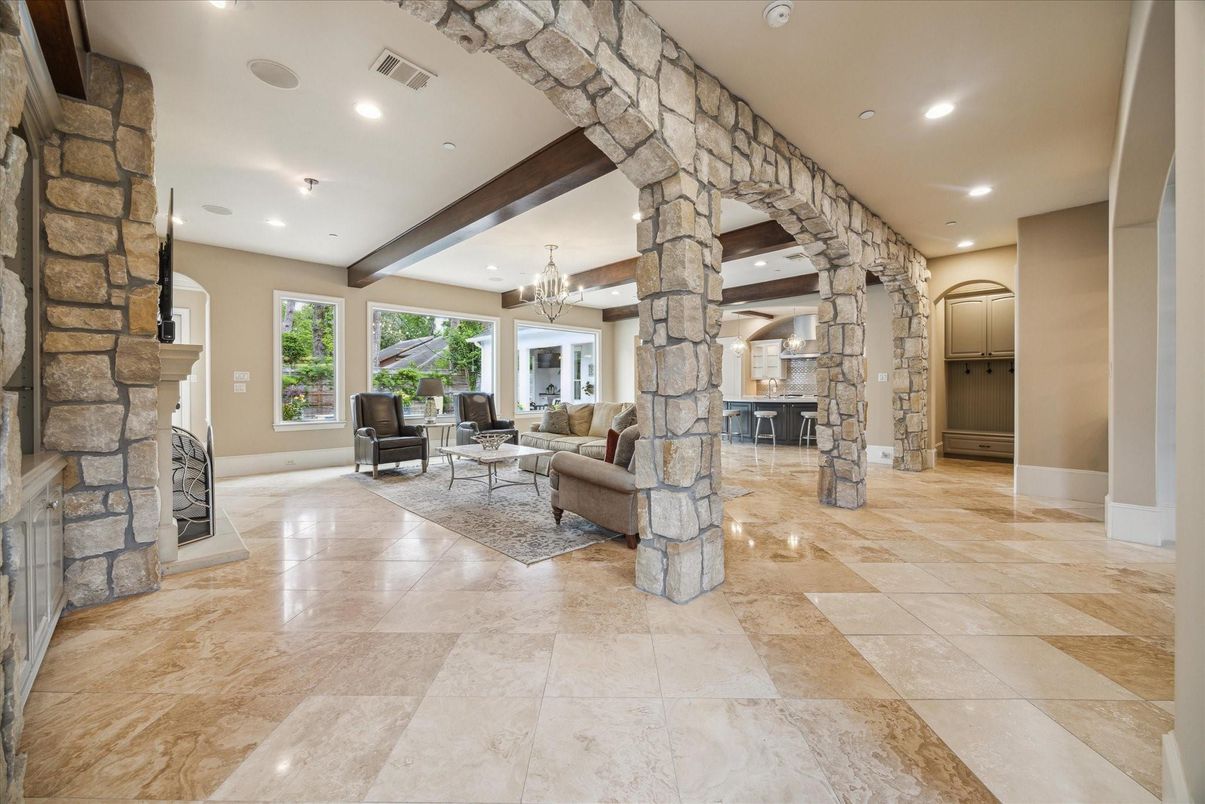 Chandelier, Fireplace, Interior, Living room, Recessed Lighting, Stone Walls, Wooden Beams