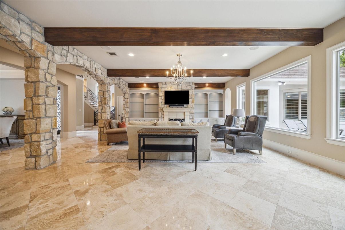 Chandelier, Fireplace, Interior, Living room, Recessed Lighting, Stone Walls, Wooden Beams