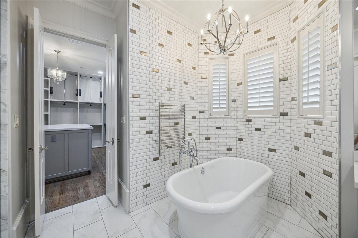 Bathroom, Chandelier, Free Standing Baths, Interior, Marble, Pendant Lights, Recessed Lighting, Stone Walls