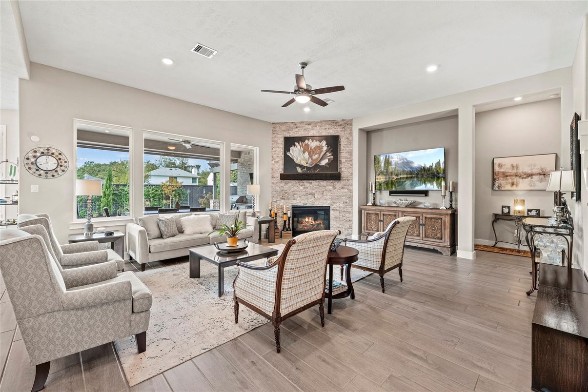 Fireplace, Interior, Living room, Recessed Lighting, Stone Walls, Wood Texture Flooring