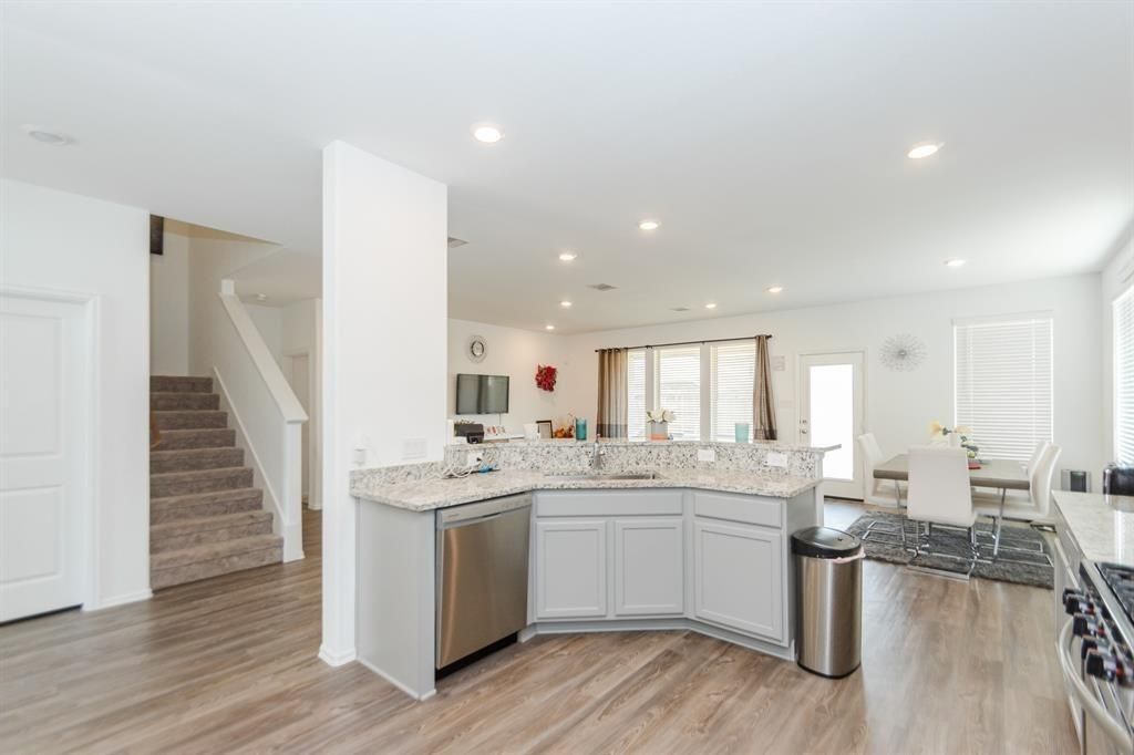 Dining room, Interior, Kitchen, Recessed Lighting, Stainless Steel Appliances, Wood Texture Flooring