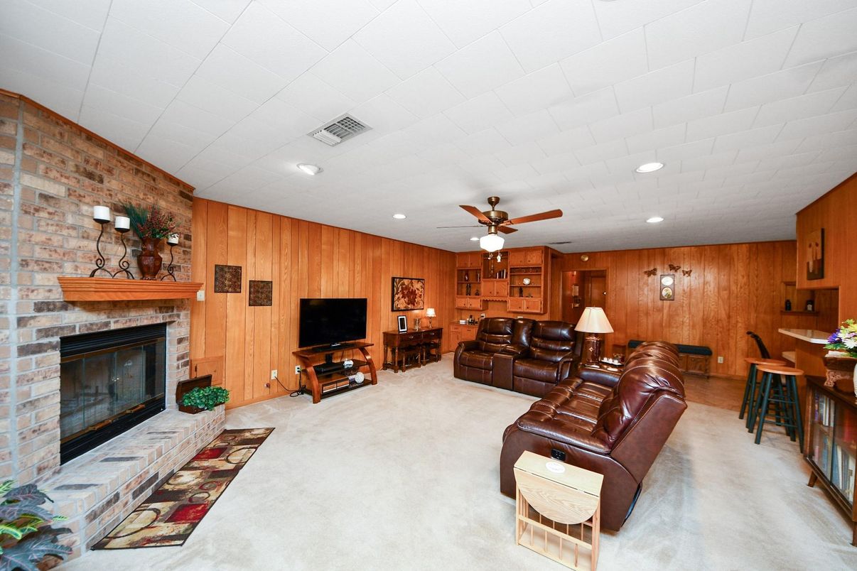 Dining room, Fireplace, Interior, Living room, Recessed Lighting, Stone Walls, Wooden Walls