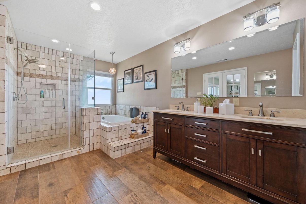 Bathroom, Dual Sink Vanities, Glass Shower, Interior, Pendant Lights, Recessed Lighting, Wood Texture Flooring