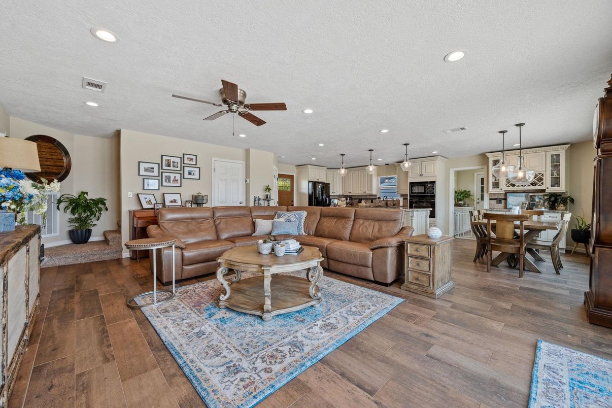 Dining room, Interior, Kitchen, Living room, Pendant Lights, Recessed Lighting, Stainless Steel Appliances, Wood Texture Flooring