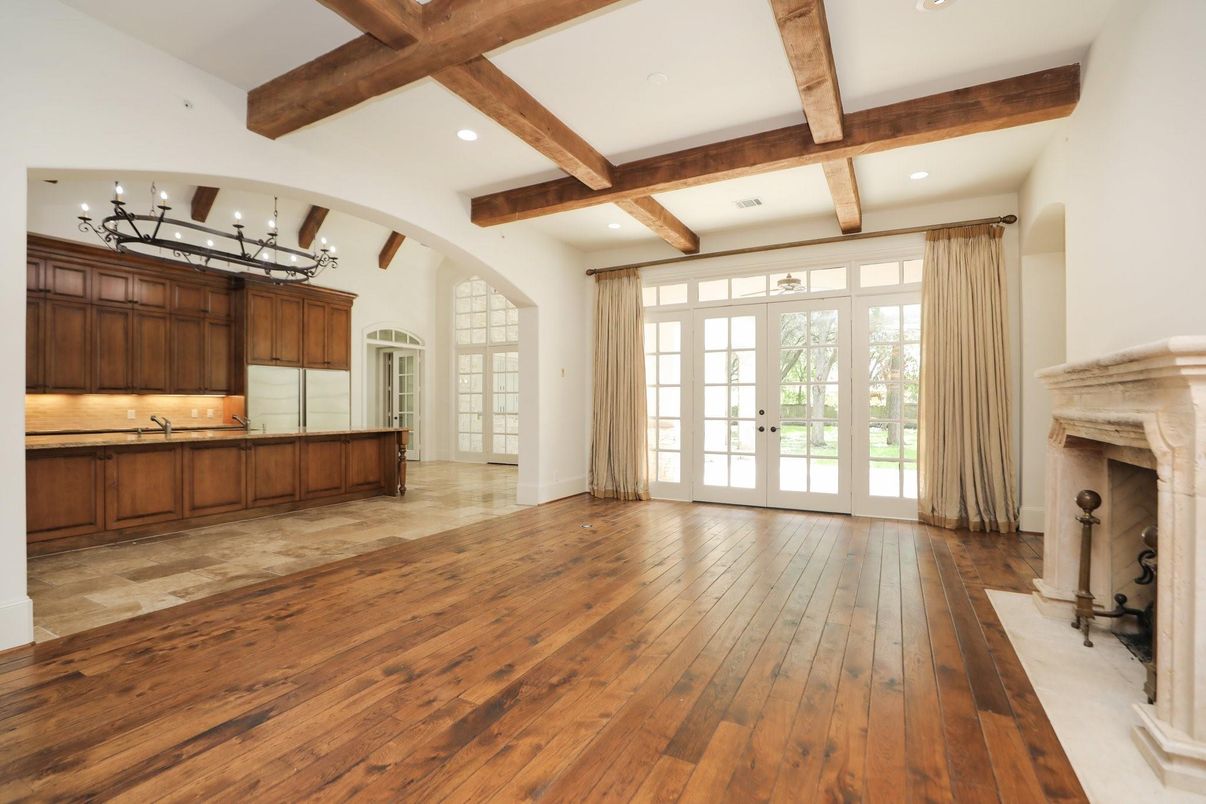 Chandelier, Empty room, Fireplace, Interior, Recessed Lighting, Wooden Beams, Wood Texture Flooring