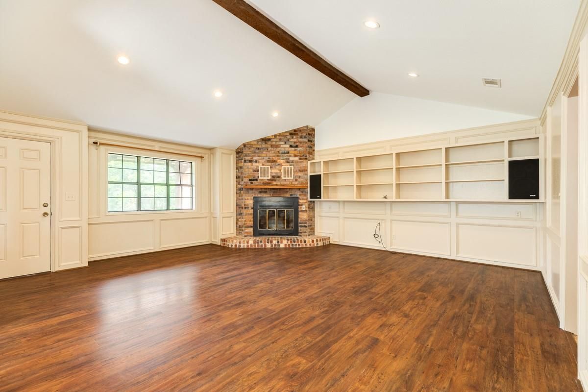 Empty room, Fireplace, Interior, Recessed Lighting, Stone Walls, Wooden Beams, Wood Texture Flooring