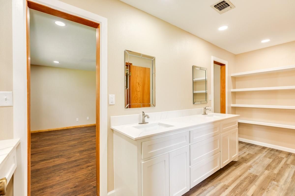Bathroom, Dual Sink Vanities, Interior, Recessed Lighting, Wood Texture Flooring
