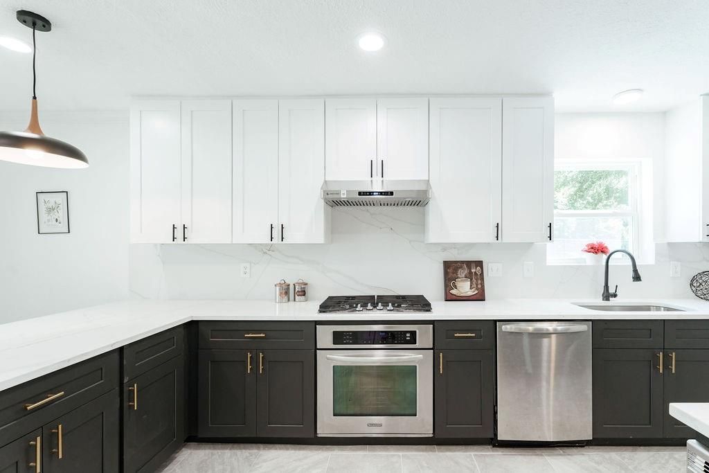 Interior, Kitchen, Marble Walls, Pendant Lights, Recessed Lighting, Stainless Steel Appliances