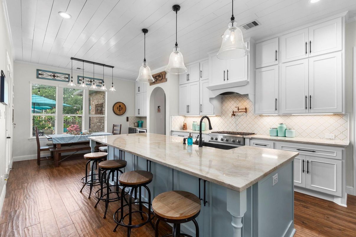 Dining room, Interior, Kitchen, Pendant Lights, Recessed Lighting, Stainless Steel Appliances, Wood Texture Flooring