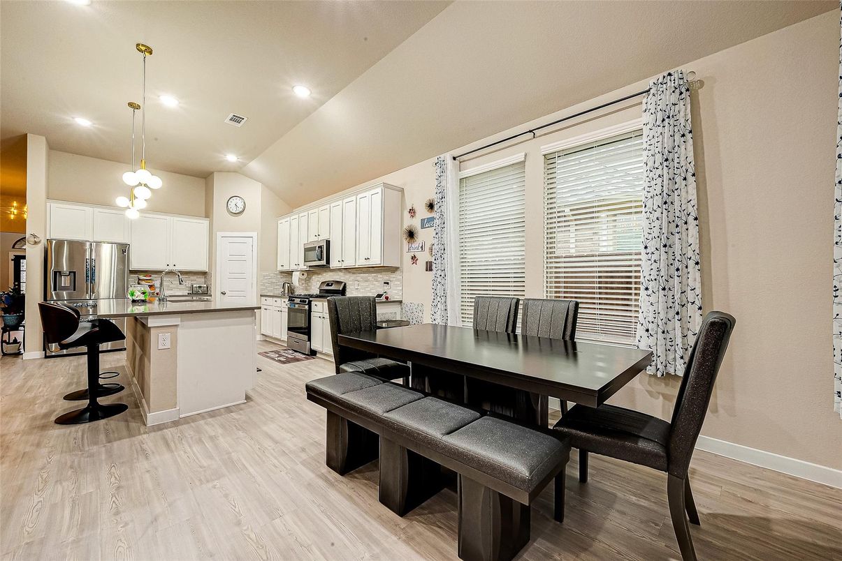Dining room, Interior, Kitchen, Pendant Lights, Recessed Lighting, Stainless Steel Appliances, Wood Texture Flooring