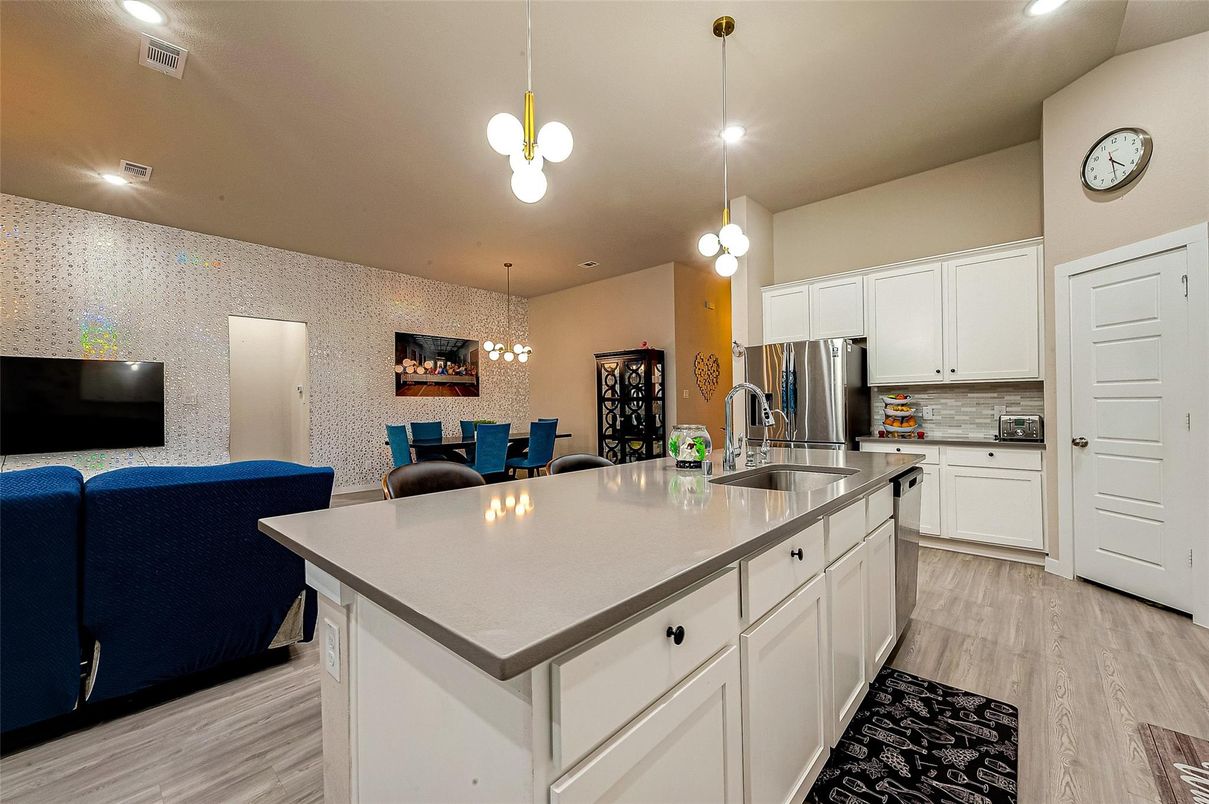 Dining room, Interior, Kitchen, Pendant Lights, Recessed Lighting, Stainless Steel Appliances, Wood Texture Flooring