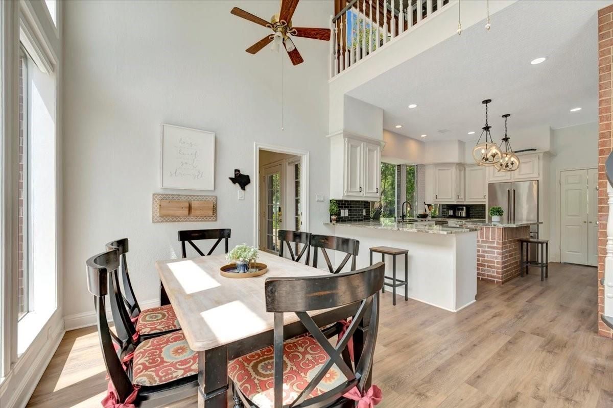 Chandelier, Dining room, Interior, Kitchen, Recessed Lighting, Stainless Steel Appliances, Wood Texture Flooring