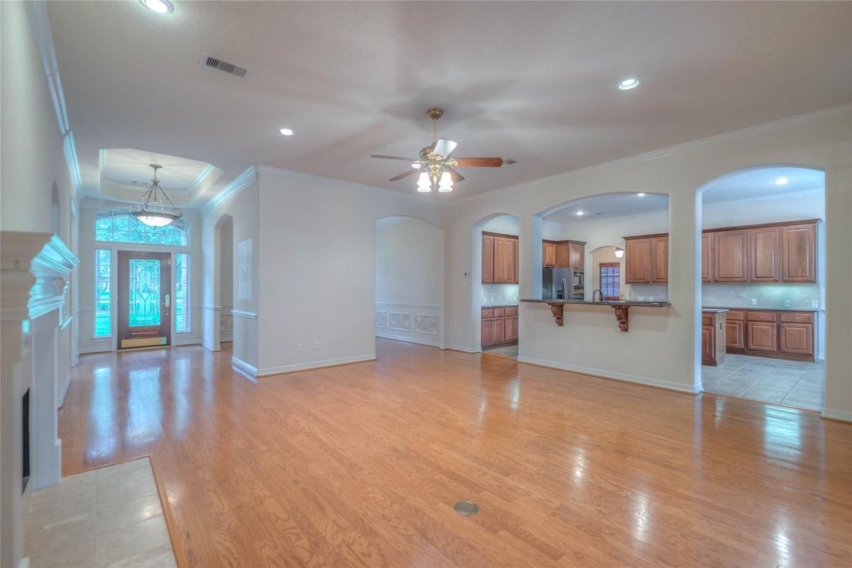 Empty room, Fireplace, Interior, Kitchen, Pendant Lights, Recessed Lighting, Wood Texture Flooring