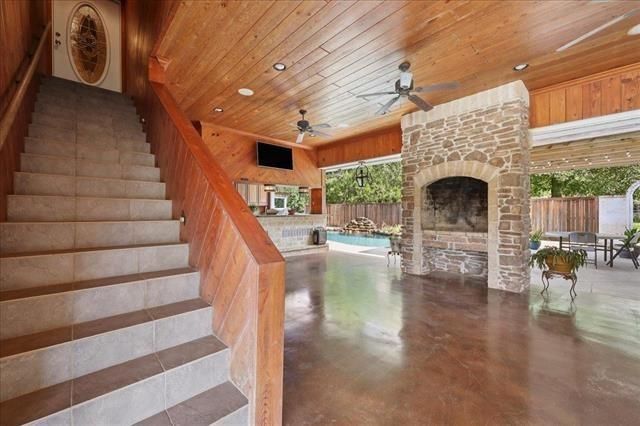 Exterior, Fireplace, Pool, Recessed Lighting, Stone Walls, Wooden Ceilings