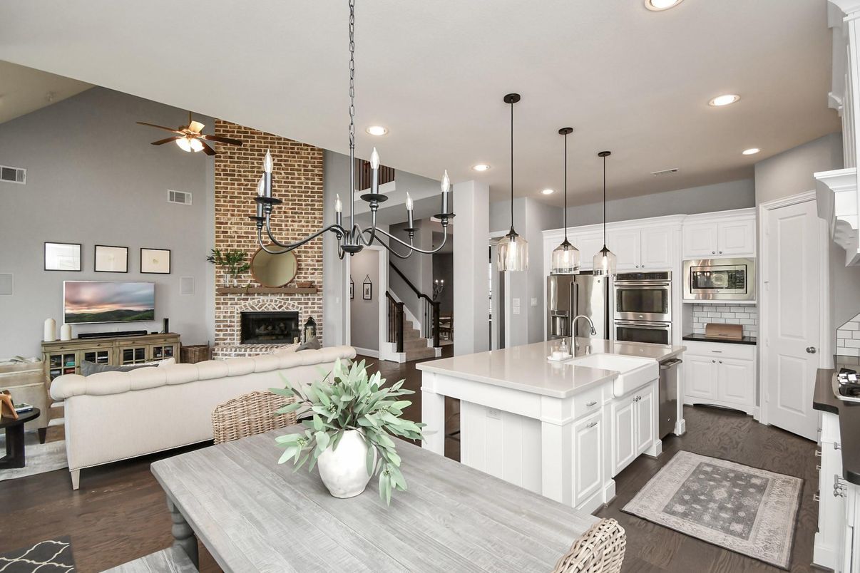 Fireplace, Interior, Kitchen, Living room, Pendant Lights, Recessed Lighting, Stainless Steel Appliances, Stone Walls, Wood Texture Flooring