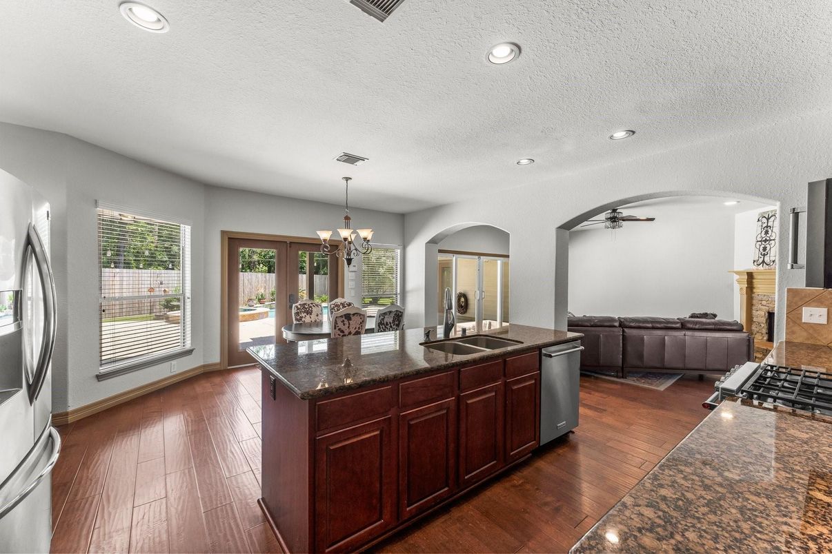 Chandelier, Fireplace, Interior, Kitchen, Recessed Lighting, Wood Texture Flooring