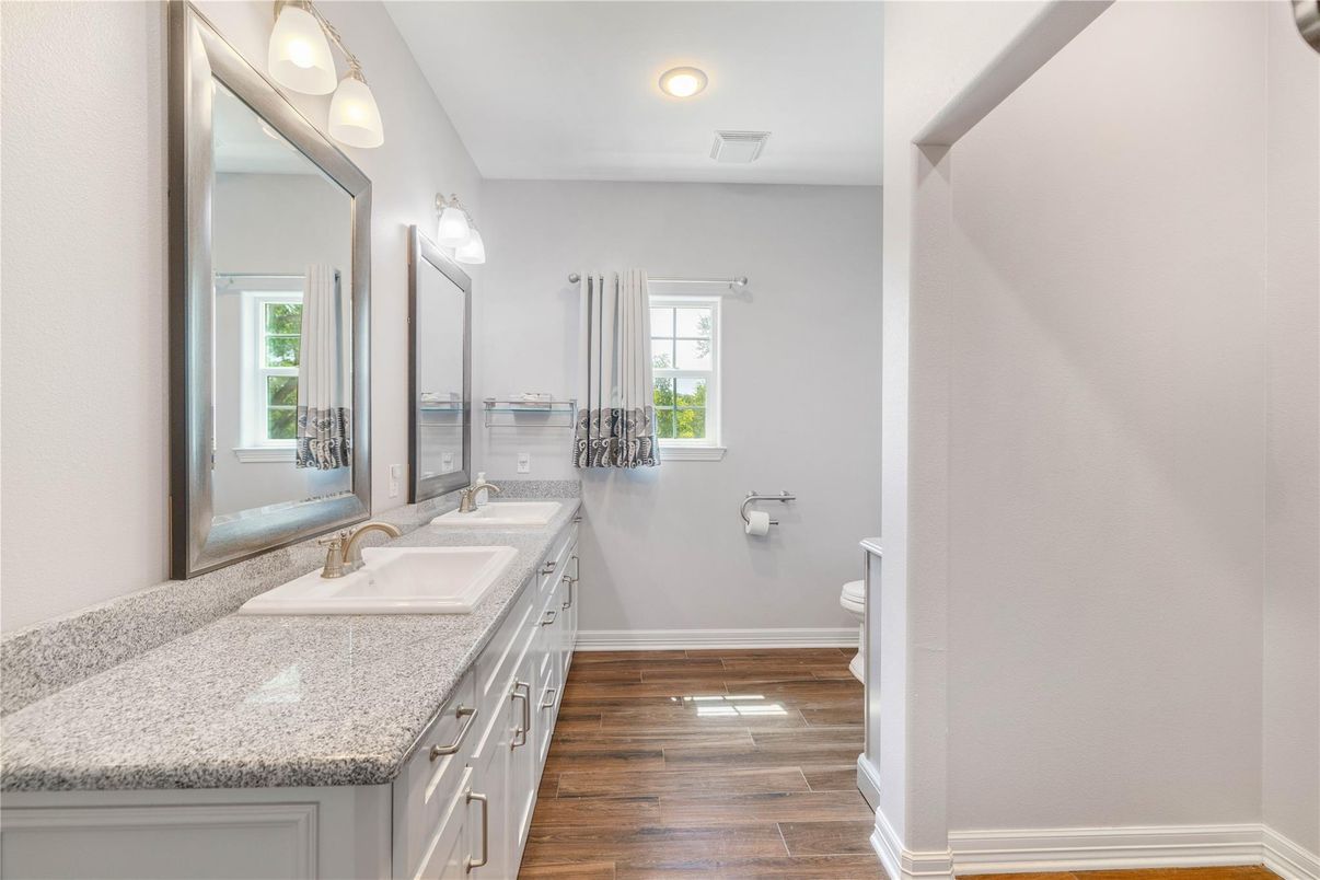 Bathroom, Dual Sink Vanities, Interior, Recessed Lighting, Wood Texture Flooring