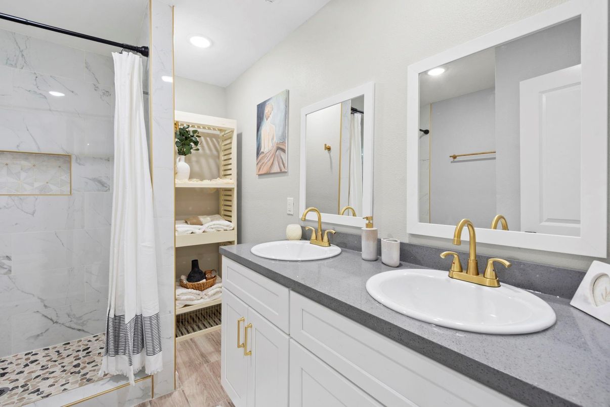 Bathroom, Dual Sink Vanities, Interior, Marble Walls, Recessed Lighting, Wood Texture Flooring