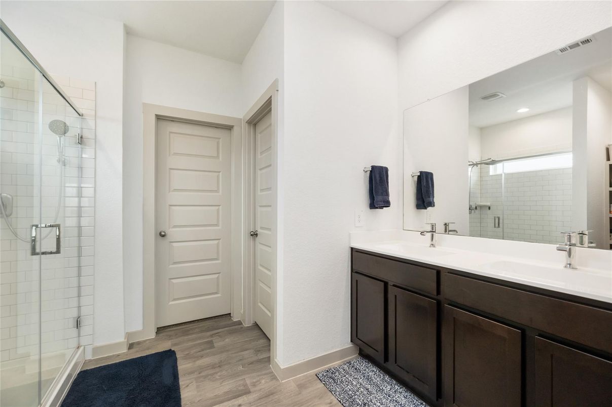 Bathroom, Dual Sink Vanities, Glass Shower, Interior, Recessed Lighting, Wood Texture Flooring