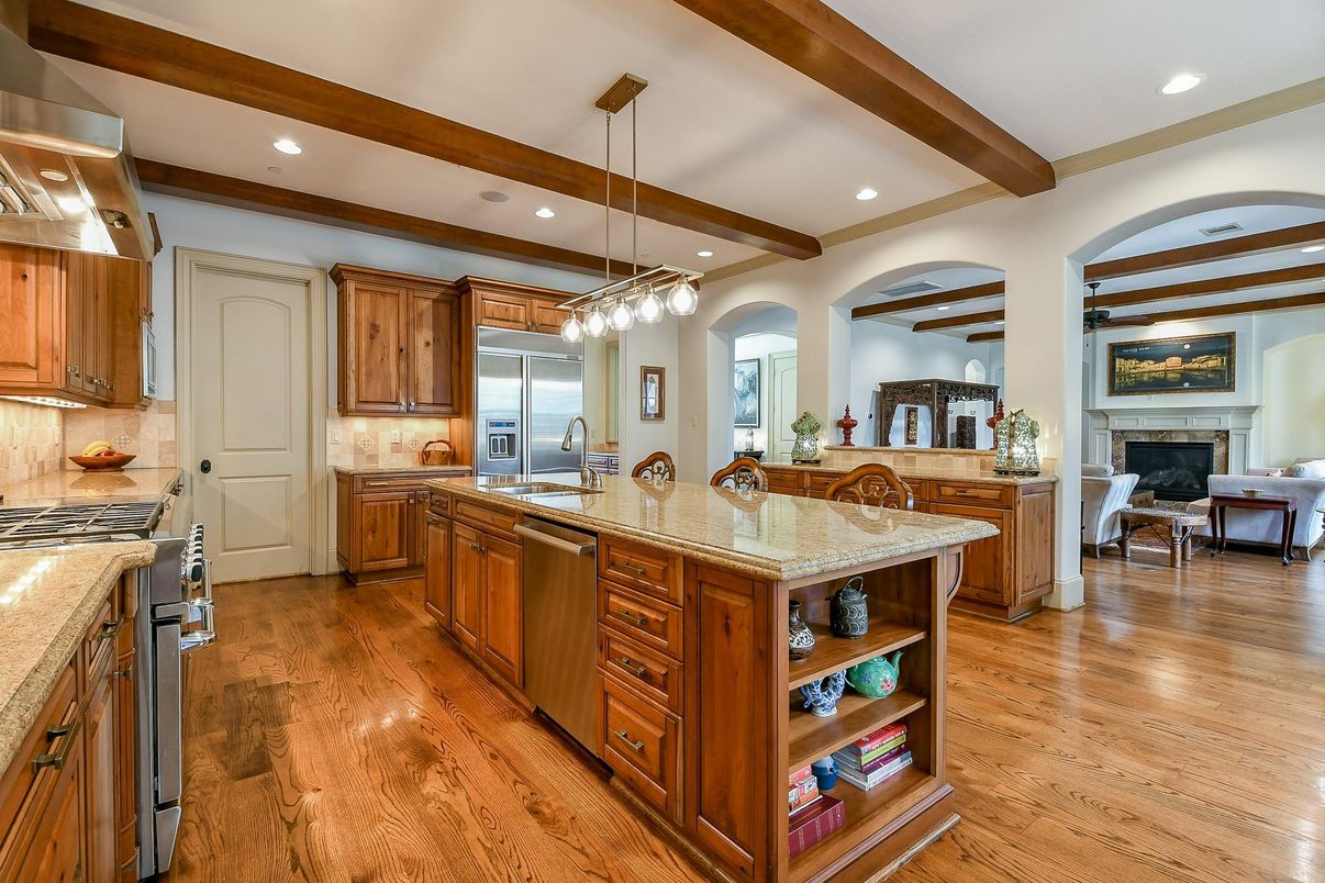 Fireplace, Interior, Kitchen, Living room, Pendant Lights, Recessed Lighting, Stainless Steel Appliances, Wooden Beams, Wood Texture Flooring