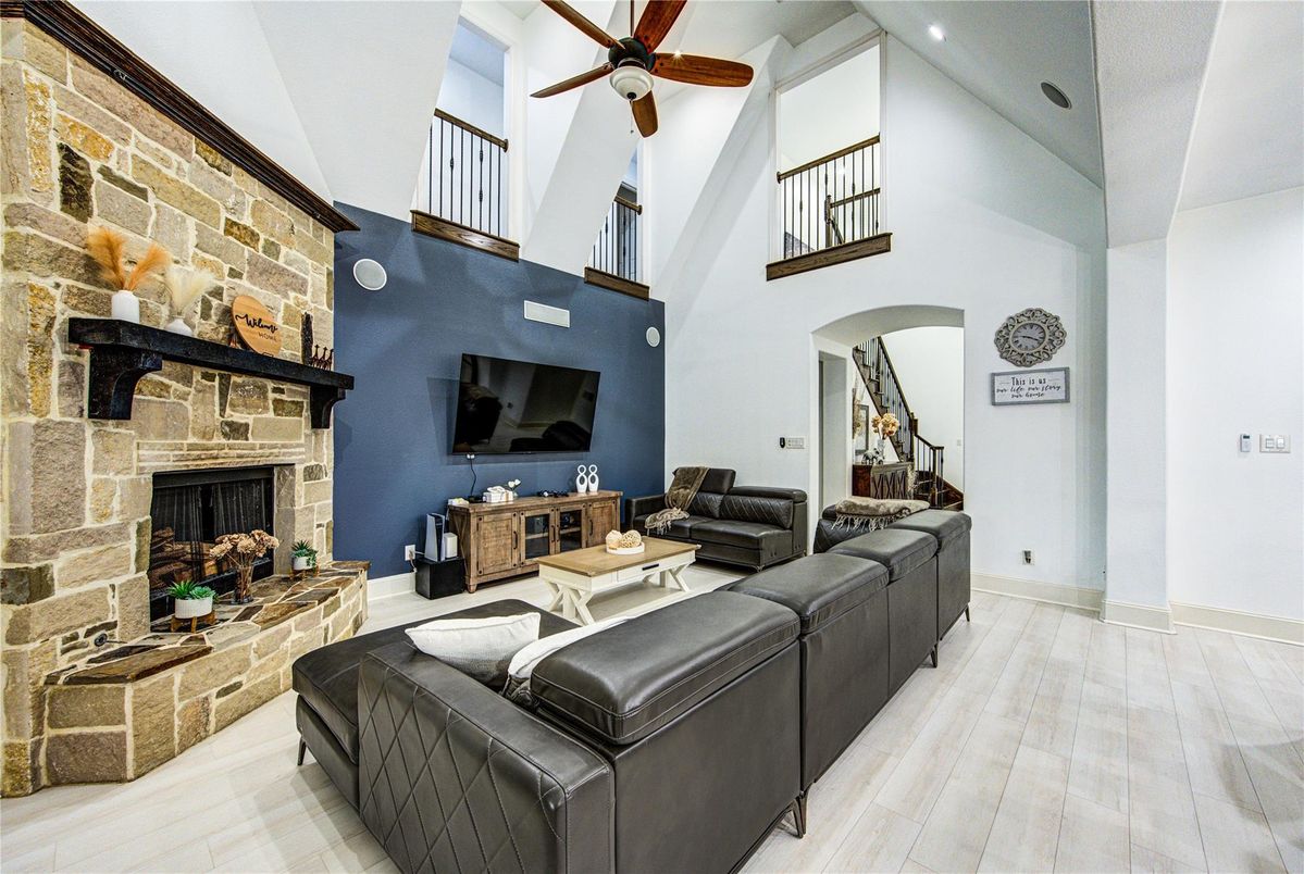 Fireplace, Interior, Living room, Recessed Lighting, Stone Walls, Wood Texture Flooring