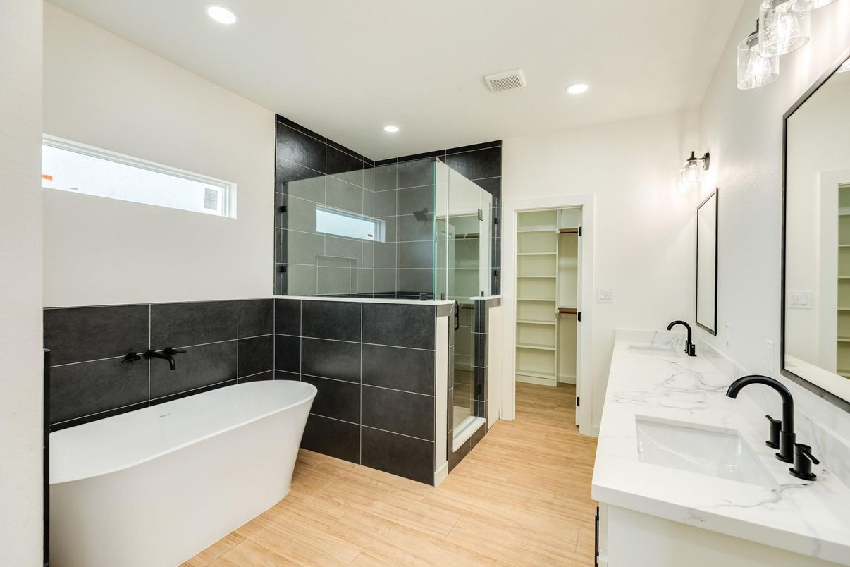 Bathroom, Dual Sink Vanities, Free Standing Baths, Glass Shower, Interior, Recessed Lighting, Wood Texture Flooring