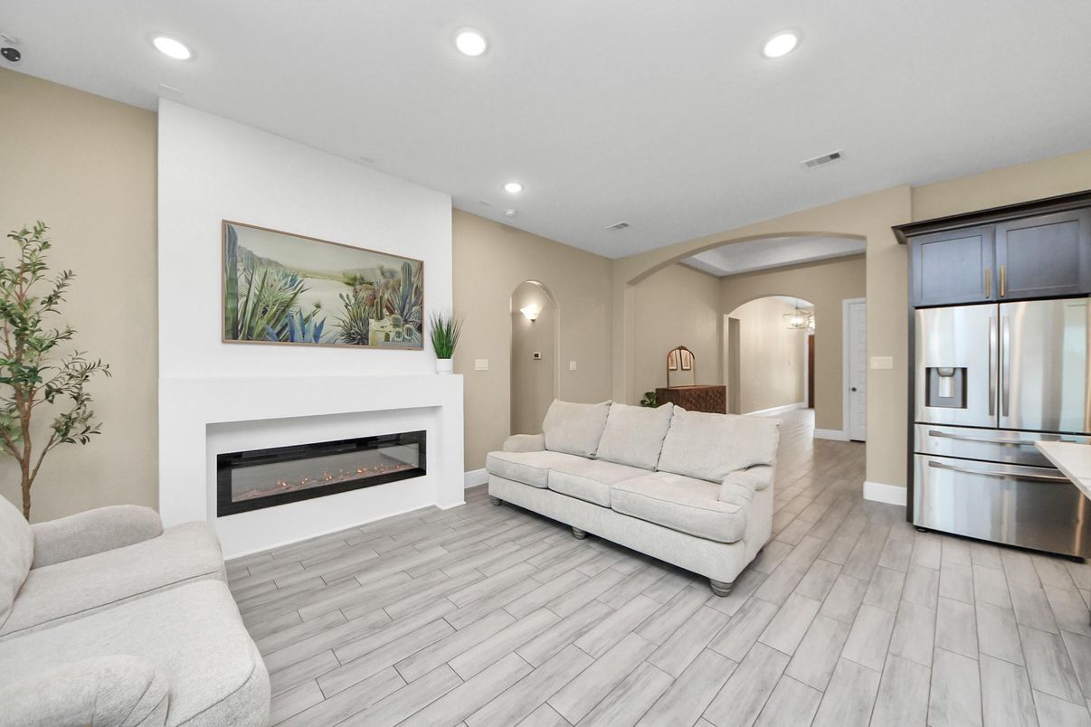 Fireplace, Interior, Kitchen, Living room, Recessed Lighting, Stainless Steel Appliances, Wood Texture Flooring