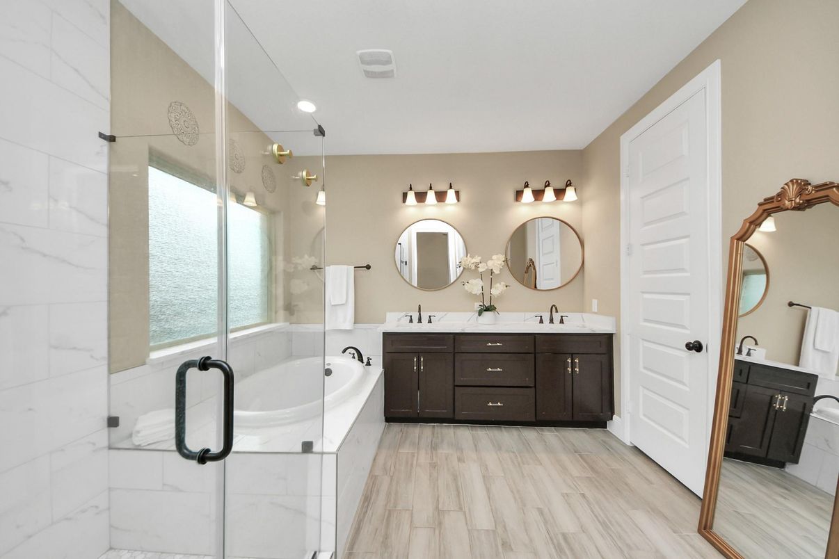 Bathroom, Dual Sink Vanities, Interior, Marble Walls, Recessed Lighting, Wood Texture Flooring