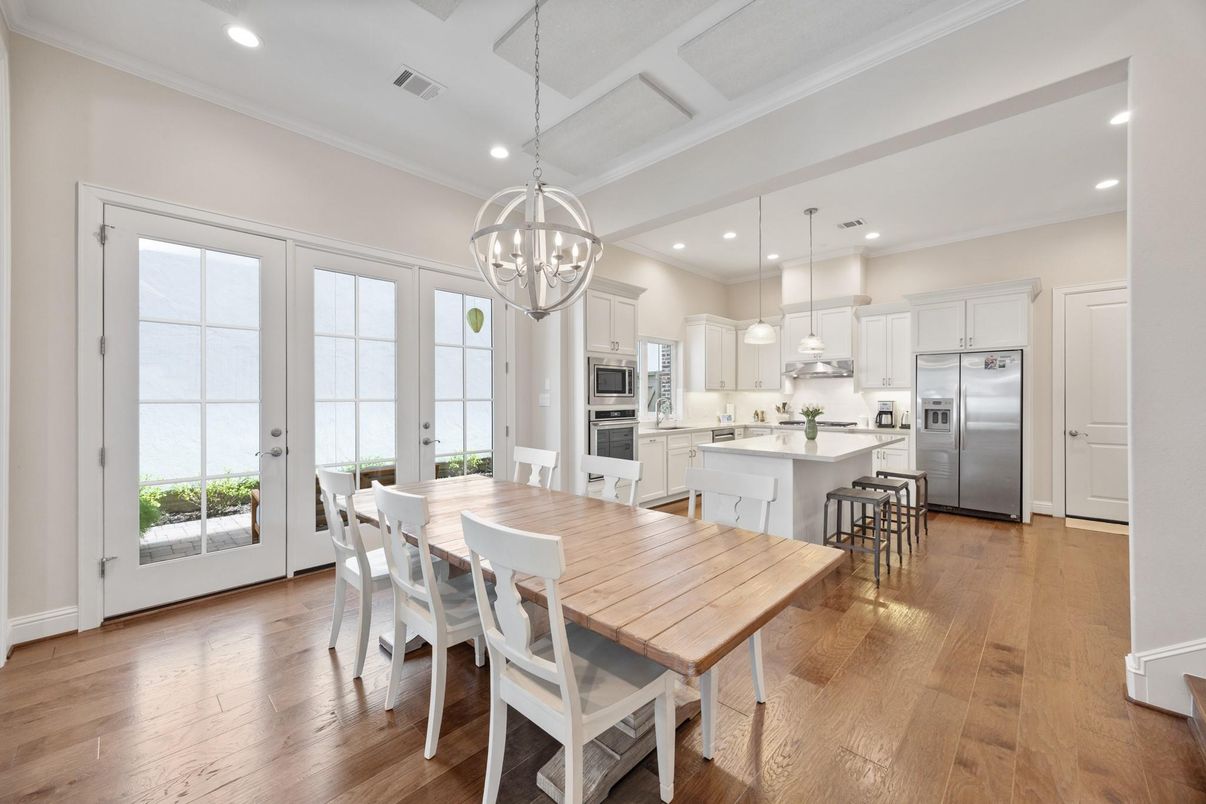 Chandelier, Dining room, Interior, Kitchen, Pendant Lights, Recessed Lighting, Stainless Steel Appliances, Wood Texture Flooring